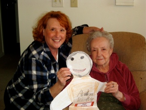 Marylin and Mary holding granddaughter/great-granddaughter Grace's "Flat Grace" art doll
