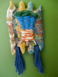 Molly's yarn and clay Indian wall hanging.