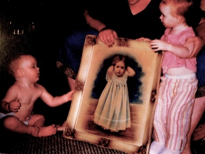Young Gannon and Grace, receiving the portrait of their great-great-grandmother Grace, so they'll know about her life.