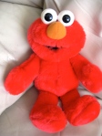 Hug him and Elmo tells you: "Hugs and kisses" ~ "Elmo loves you!"  and he makes kissing sounds!