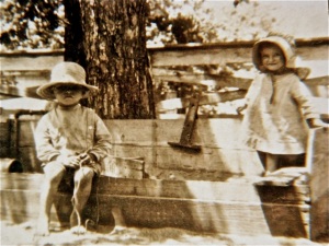 1921 ~ Mom with her brother in the sandbox on the farm, enjoying the sunny day.