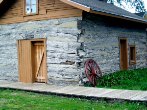 1800s log home with door covers in case of attack.