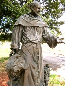 1945 statue of St. Francis near the entrance to the Franciscan Center.