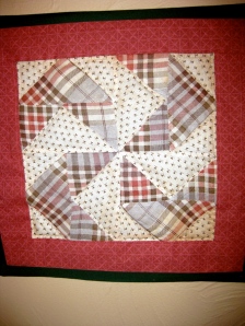One block from a quilt of "The Flying Windmill" pattern.  Turn it on it's side and it's the Nazi symbol.