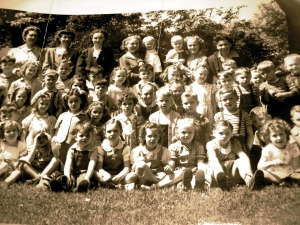 Mom (top row, third from left) ~ a young kindergarten teacher. 