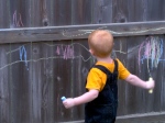 Before Gannon could write, he "practiced" with chalk on the fence.