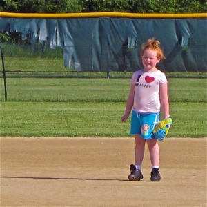 Grace's great-great-granddaughter at age 6, learning to play softball.  But she loves to draw, too.