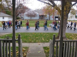 Abilene, KS h.s. marching band practices in the streets, a happy, musical way to welcome Thanksgiving!